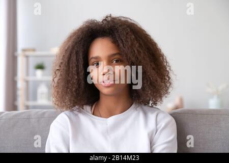 Pretty african teen girl vlogger talking to camera recording vlog Stock Photo