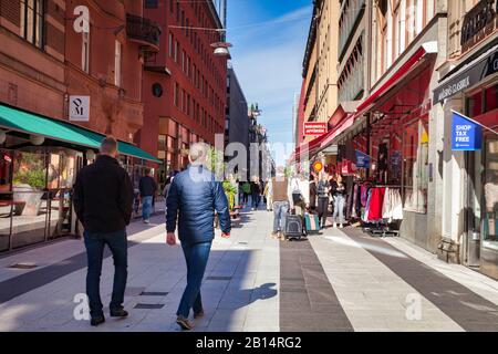 16 September 2018: Stockholm, Sweden - Shoppers and tourists  in Drottninggatan on a bright sunny autumn weekend.