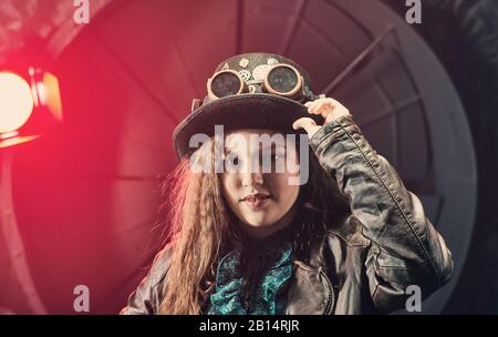 Beautiful steampunk teen girl  over vintage background , model in the style of a steampunk in a beautiful creative studio. Fashion, style Stock Photo