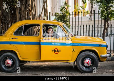Yellow taxi in the street of the Kolkata, India, Asia. Stock Photo