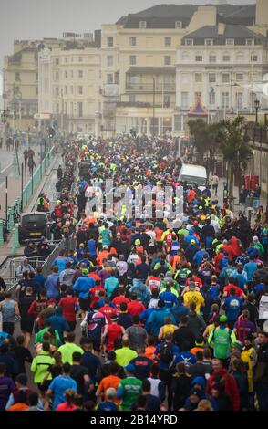Brighton UK 23rd February 2020 - Thousands take part in The Grand Brighton Half Marathon in wet and windy weather conditions . Over ten thousand runners took part and this years official charity partners is The Sussex Beacon which provides specialist care and support for people living with HIV  : Credit Simon Dack / Alamy Live News Stock Photo