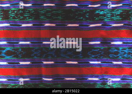 Detail of a wrinkled traditional Mayan Guatemalan woven colorful striped fabric Stock Photo