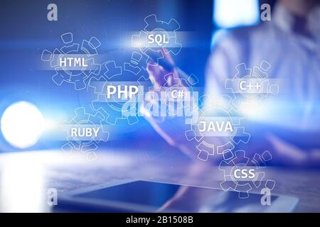 Web development tools concept on virtual screen. Programming language and scripts. PHP, SQL, HTML, Java and others Stock Photo