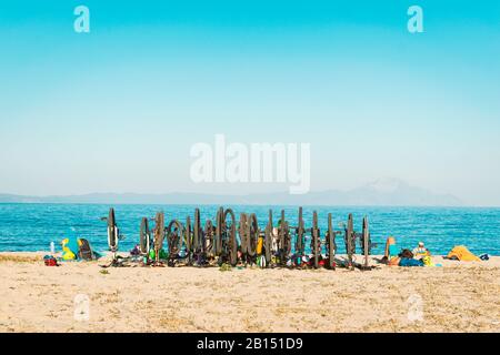 Bicycles on the beach. Summer time bicycle riders resting on a warm sand beside the sea. Stock Photo