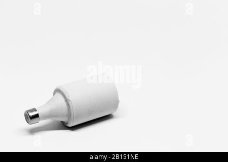 a ceramic electrical fuse on white background Stock Photo