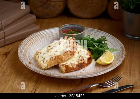 Closeup of a tuna melt topped with cheddar cheese Stock Photo