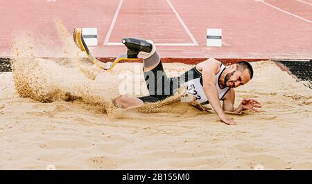 athlete disabled amputee on prosthetic long jump in para athletics Stock Photo