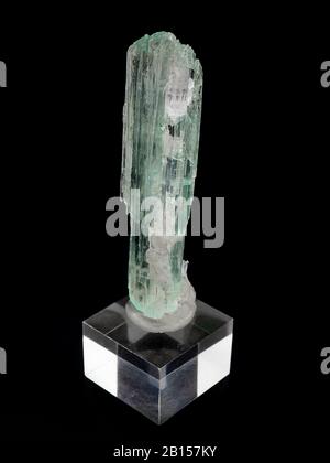 Hiddenite (Green Spodumene) mineral on black background Stock Photo