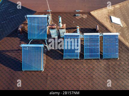 Solar water heater installed on a roof Stock Photo - Alamy