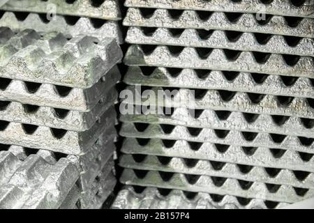 stack of aluminium ingots - close-up with selective focus Stock Photo