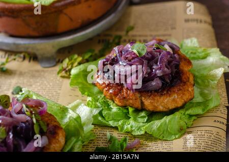 Delicious steak with caramelized red onion and fresh herbs on salad Stock Photo