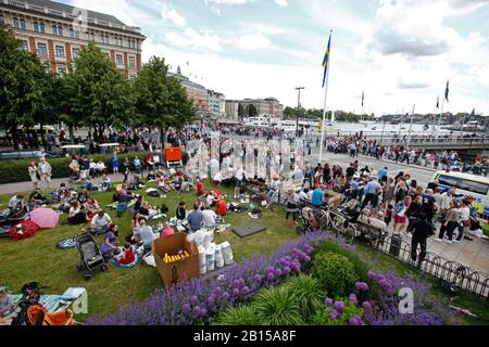 People at Karl XII's square in Stockholm city during the wedding between Crown Princess Victoria and Prince Daniel. The wedding of Victoria, Crown Princess of Sweden, and Daniel Westling took place on 19 June 2010 in Stockholm Cathedral.Stockholm 2010-06-19 Photo Jeppe Gustafsson Stock Photo