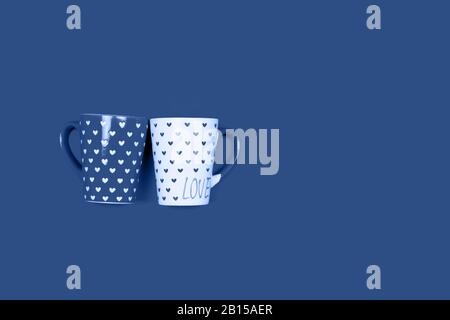 Couple of beautiful cups on blue. Stock Photo