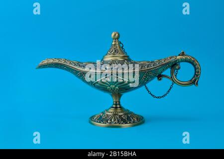 Brass Genie Lamp Emitting Blue Smoke Against White Backdrop Stock Photo -  Download Image Now - iStock