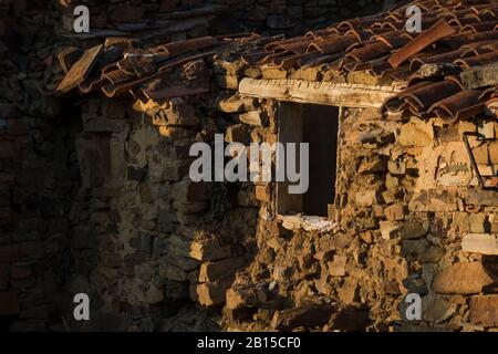 Ruined houses at sunset in Sarnago abandoned village in Soria province, Spain Stock Photo