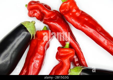 Top view on red bell peppers and zucchinis, white background Stock Photo