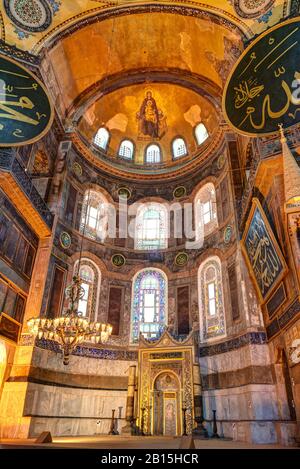 Inside the Hagia Sophia in Istanbul, Turkey. The apse with the image of the Virgin at the top. Hagia Sophia is the greatest monument of Byzantine Cult Stock Photo