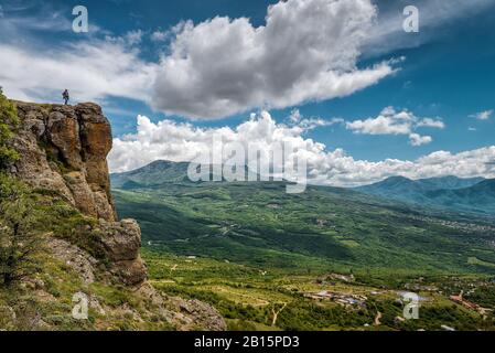 Tourist on the Demerdji mountain. Landscape of Crimea, Russia. Stock Photo