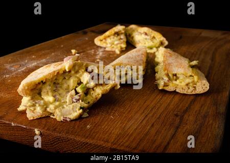 Cypriot pie chicken sauce wood background Stock Photo