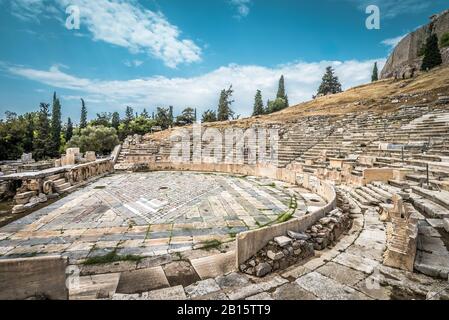 Theatre of Dionysus at the foot of Acropolis, Athens, Greece. It is one of the main landmarks in Athens. Panorama of the Ancient Greek ruins in Athens Stock Photo