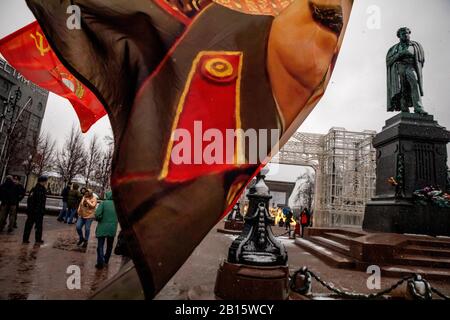 Moscow, Russia. 23rd of February, 2020 People hold banners with portrait of Soviet leader Josef Stalin during a rally and a march in central Moscow marking the 102nd anniversary of the founding of the Soviet Red Army and the Soviet Navy Stock Photo