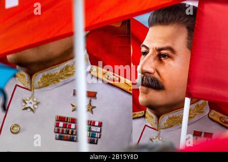 Moscow, Russia. 23rd of February, 2020 Participants in a rally and a march in central Moscow marking the 102nd anniversary of the founding of the Soviet Red Army and the Soviet Navy. People hold banners with portrait of Soviet Russian leader Josef Stalin Stock Photo