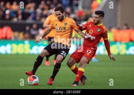 Wolverhampton, UK. 23rd Feb, 2020. Joao Moutinho of Wolverhampton Wanderers (L) in action with Emiliano Buendia of Norwich City (R). Premier league match, Wolverhampton Wanderers v Norwich city at Molineux Stadium in Wolverhampton on Sunday 23rd February 2020. this image may only be used for Editorial purposes. Editorial use only, license required for commercial use. No use in betting, games or a single club/league/player publications. pic by Steffan Bowen/Andrew Orchard sports photography/Alamy Live news Credit: Andrew Orchard sports photography/Alamy Live News Stock Photo