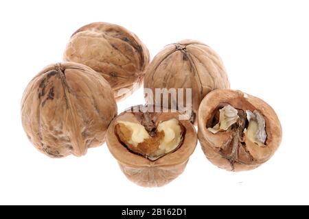 Whole and cracked walnuts isolated on white background Stock Photo