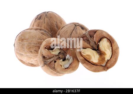 Whole and cracked walnuts isolated on white background Stock Photo
