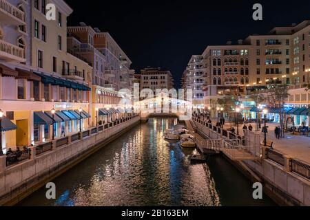 Buildings and water channels in Qanat Quartier, a new housing and business development on the northeastern cost of Qatar's capital city, Doha Stock Photo