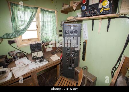 The radio room in Station W, an old British scientific research station on Detaille Island, Graham Land, Antarctica. Stock Photo