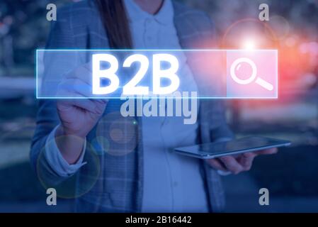 Conceptual hand writing showing B2B. Concept meaning Exchange of products services information between businesses E Commerce Stock Photo