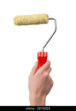 New paint roller in a male hand in a vertical shot isolated on white background Stock Photo