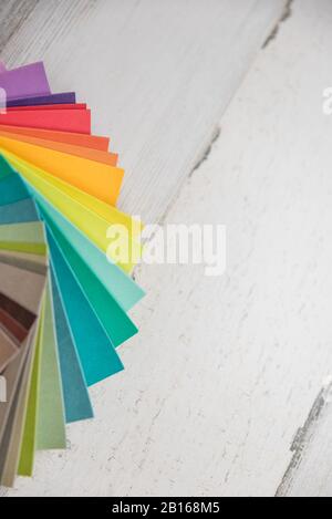 Colorful stack of sample test swatches for paint or fabric in spectrum rainbow colors with blank empty room space for text or copy. Stock Photo