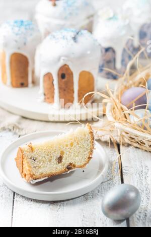 Easter table with Easter cakes and Easter eggs over white background Stock Photo