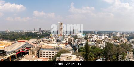 Aerial View of Skyscrapers in Downtown Bangalore With Train Stration in the Foreground Stock Photo