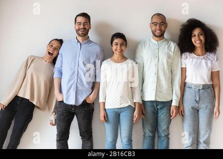 Multiethnic friends having fun fooling around posing looking at camera Stock Photo
