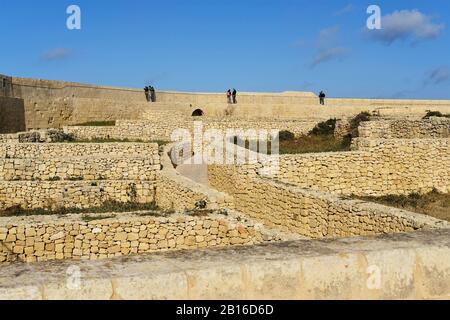 Victoria, Gozo, Malta 02/02/2020 Tourist visting citadel 'Citadella' and admiring view Stock Photo