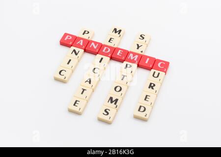 Letter tiles for medical response to 2020 cases in Coronavirus Pandemic COVID-19 which WHO may classify as a pandemic. Symptoms, medication, etc. Stock Photo