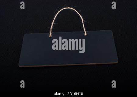 Rectangular shaped black notice board on black background Stock Photo