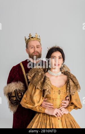 queen and smiling king with crowns holding hands isolated on grey Stock  Photo - Alamy