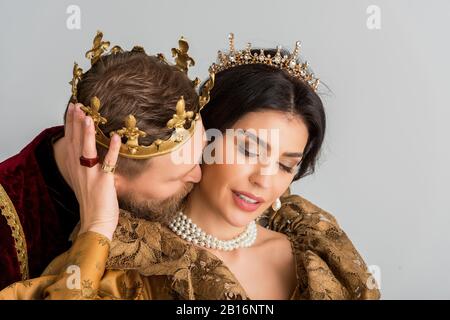 queen and smiling king with crowns holding hands isolated on grey Stock  Photo - Alamy