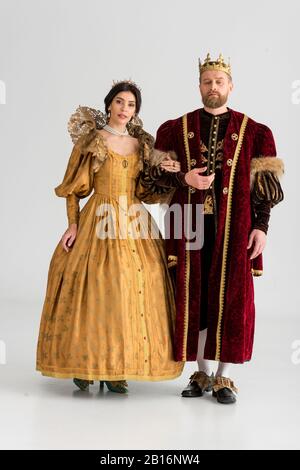 queen and smiling king with crowns holding hands isolated on grey Stock  Photo - Alamy