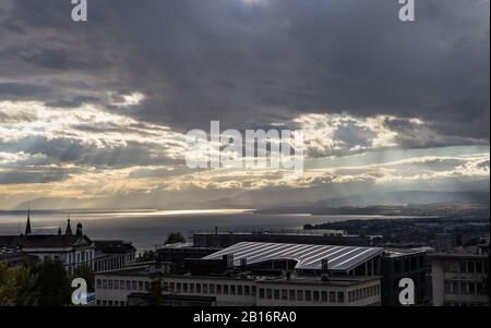 Dramatic stormy sky over the lake Leman. Beautiful view on lake Leman at evening and sunset. City of Lausanne, canton Vaud, Switzerland Stock Photo
