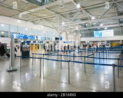 Athens, Greece - February, 11 2020: Athens International Airport Eleftherios Venizelos. Passengers in the departure hall of the main terminal looking Stock Photo