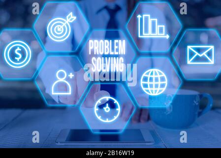 Writing note showing Problem Solving. Business concept for to find an answer or means of effectively dealing with Stock Photo
