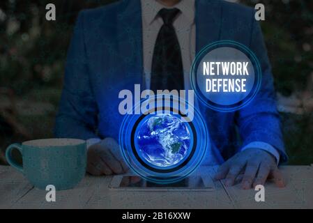 Handwriting text writing Network Defense. Conceptual photo easures to protect and defend information from disruption Elements of this image furnished Stock Photo