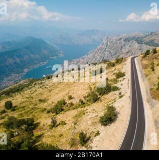 Aerial view of the Bay of Kotor, Boka. Scenic road overlooking the bay of the Kotor fjord. Winding roads to discover Montenegro. Tourism and cruise Stock Photo