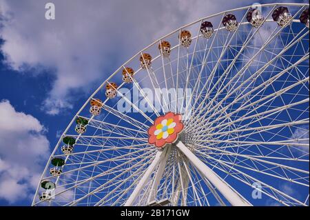 Vienna, Austria - February 20, 2020: New Ferris Wheel in Prater Park against blue cloudy sky. Stock Photo