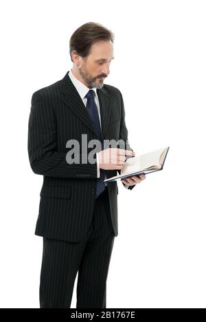 Lecturer with book. Business school education. Serious businessman hold book. Mature man reading book. Keep studying. Education for adults. Self education. Teacher lecturer speaker. Making notes. Stock Photo